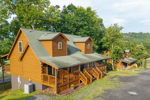 Welcome to your peaceful mountain retreat - two spacious log cabins side-by-side, offering 12 bedrooms and 12 baths, perfect for large gatherings.