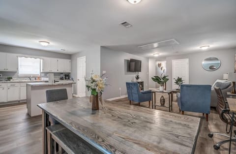 Open concept kitchen, dining space, and living room