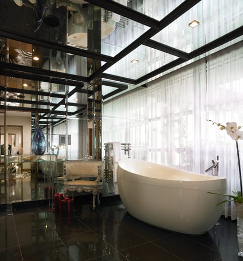 Combined shower/tub, bathrobes, slippers, towels