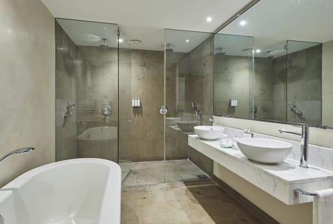 Combined shower/tub, bathrobes, slippers, towels