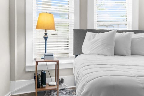 Comfy bedding with fluffy pillows.