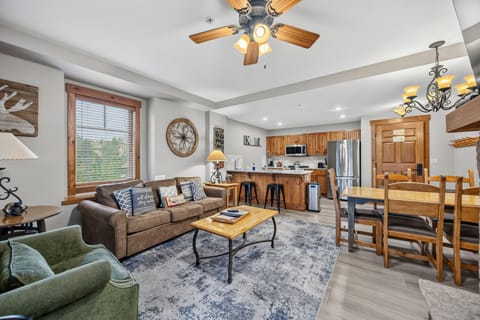 Spacious open-concept living, dining, and kitchen area.