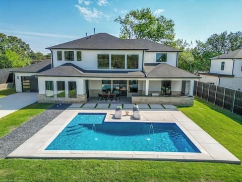 Backyard with view of pool and Sun lounge charges. 4 lounge chairs added