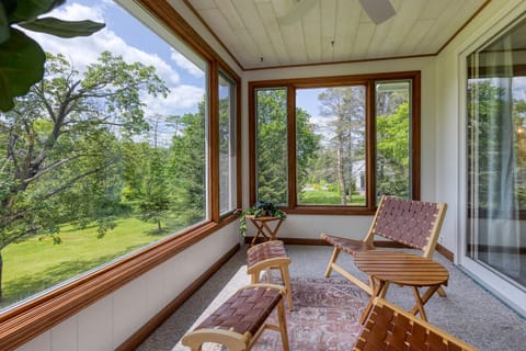 Relax and unwind on the sun-drenched porch, surrounded by the beauty of nature.