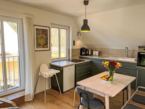 Furniture, Kitchen, Interior Design, Flooring, Wood, Countertop, Chair, Kitchen & Dining Room Table, Floor, Kitchen Appliance