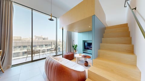 Deluxe Loft, 1 Queen Bed, Private Bathroom, City View | Desk, laptop workspace, blackout drapes, free WiFi