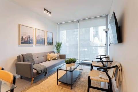 Bright and modern living room with stylish decor, perfect for relaxation and enjoying natural light.