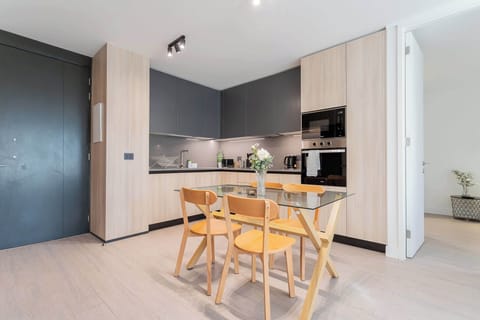Enjoy a stylish and modern kitchen perfect for family meals and gatherings, equipped with sleek appliances and a cozy dining area.