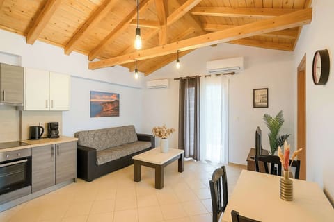 Relax in the open-plan living space – High wooden ceilings and natural light create a cozy, inviting vibe