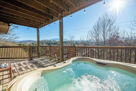 Soak your worries away in this bubbling hot tub while mountain vistas unfold before you on your private covered deck.