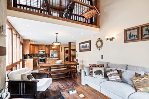 - Spacious open-concept living with vaulted ceilings and loft view  
- Dining table and kitchen flow seamlessly for easy entertaining  
- Perfect mix of rustic charm and modern comforts for groups