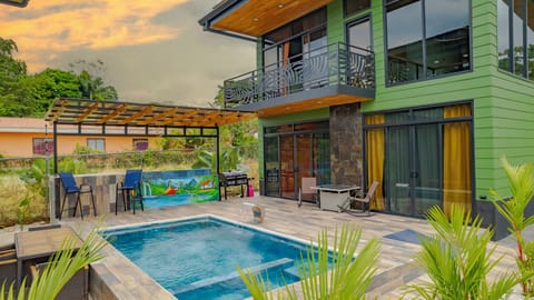 Exterior front of home with pool view