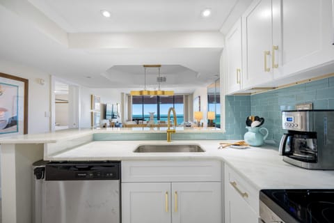 Bright and sleek kitchen with oceanview and full amenities.