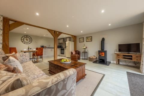 The Woodshed at Green Valley Farm, Ubbeston: Open plan living space with wood burning stove