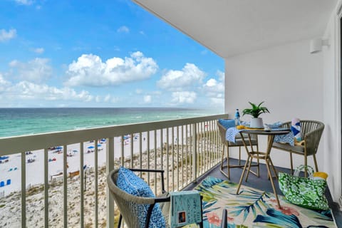 Welcome to Pelican Beach 603 - Starfish by the Sea! Your private balcony offers sweeping ocean views where you'll sip morning coffee and watch beachgoers below on pristine white sand.