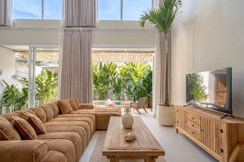 Deluxe Villa, 1 Bedroom, Patio, Pool View | Living room | 50-inch TV with cable channels