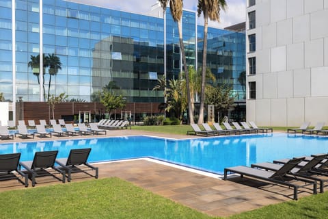 Seasonal outdoor pool, open 11:00 AM to 7:00 PM, sun loungers