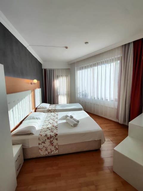 Family Twin Room, Balcony, City View | Desk, free WiFi