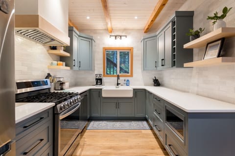 Brand new kitchen with quartz countertops, LG Appliances and cast iron farmhouse sink. 