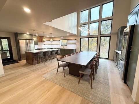 Kitchen, dining, and wet bar area, table can expand for up to 20 guests