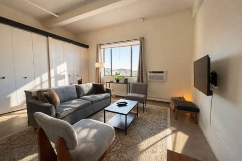 Thoughtfully laid out studio offering flexible, distinct zones for working, dining, and relaxing