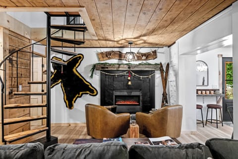 Relish in raw, pine and elegant ambiance in our fireplaced living room. Double, velvety couches.
