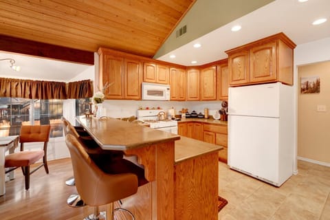Fully equipped cabin kitchen with ample cabinetry, stove, fridge, microwave, and coffee maker—perfect for cooking meals, morning coffee, and feeling right at home on your stay.