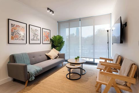 Stylish living room with modern decor, perfect for relaxation and enjoying natural light.