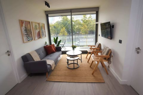 Relax in this cozy living room with a beautiful view and modern decor, perfect for unwinding after a day of exploring.