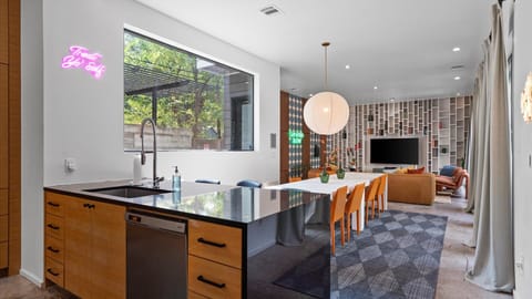 Stylish & Fully Equipped Kitchen - A sleek, contemporary kitchen with bar seating designed for both short stays and longer visits.