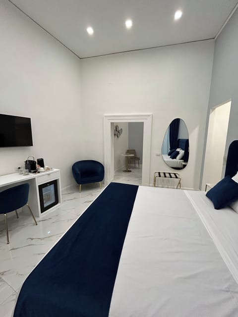 Superior Quadruple Room, Balcony, Courtyard View | Minibar, in-room safe, desk, blackout drapes