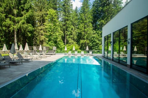 Indoor pool, outdoor pool, pool umbrellas, sun loungers