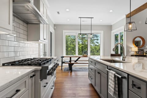 KITCHEN: opens to the deck which overlooks the pool and lake
