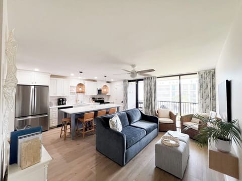 The unit boasts a spacious, open-concept floor plan with comfortable seating