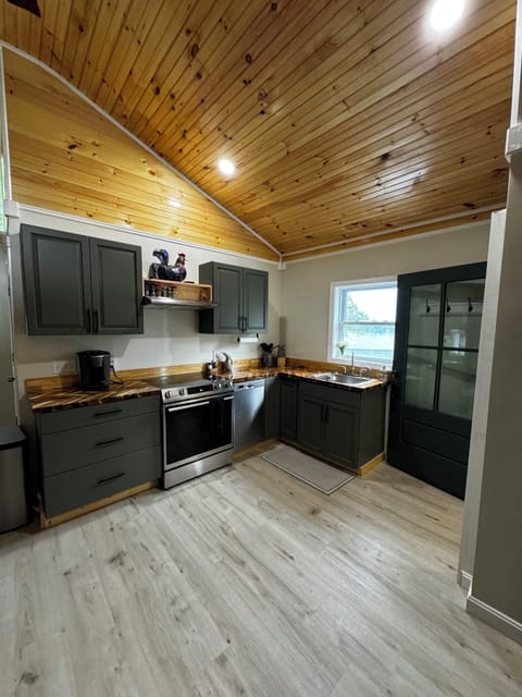 Full kitchen with all accessories and a beautiful butcher block counter