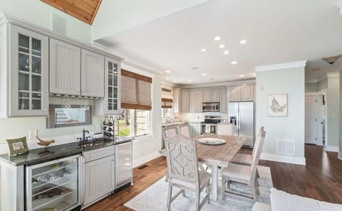 Fully stocked kitchen with bar with ice maker