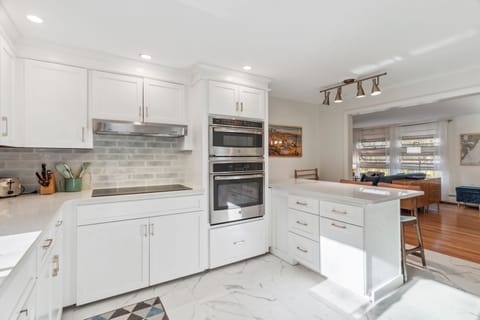 The fully renovated kitchen with wall oven and microwave, reverse osmosis drinking water, extra clothes washer, and dishwasher. Seating for 2 at the peninsula. Coffee provided!