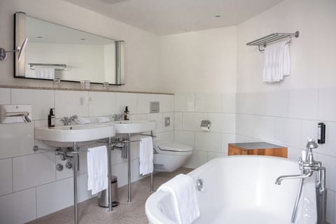 Junior Suite with South View | Bathroom | Combined shower/tub, free toiletries, hair dryer, bathrobes