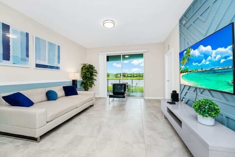Cozy living space with plush seating & Smart TV — perfect for relaxing after a day of exploring!
