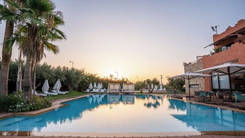 2 outdoor pools, open 10:00 AM to 7:00 PM, pool umbrellas, sun loungers