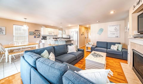 Open living room area with a view of the kitchen
