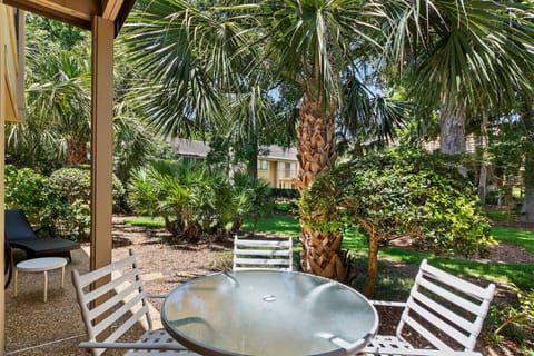 Enjoy seamless indoor outdoor living with direct access from the living room to the back patio, complete with seating, a BBQ grill, and a lounge area perfect for evening gatherings.