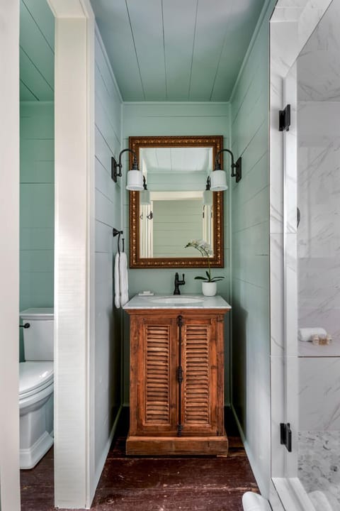 Shower, designer toiletries, hair dryer, bathrobes