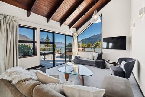 Comfortable lounge with easy access to the deck and hot tub, wood fire for cosy winter nights.
