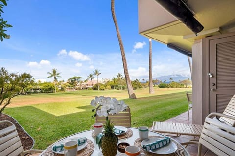 Enjoy outdoor dining on your private lanai overlooking the golf course and a peak of the ocean