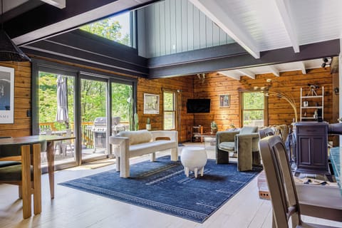 Modern comfort meets rustic charm with high ceilings and natural light.