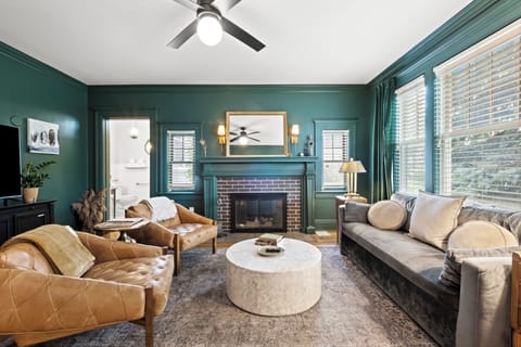 Living Room: Stylish retreat with chic decor, warm lighting, and a cozy fireplace ambiance!