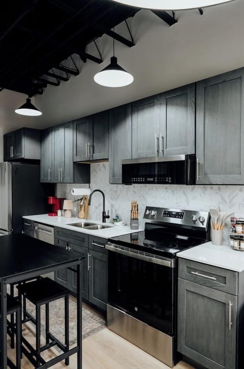 The kitchen comes equipped with a modern oven, ready to help you bake, roast, or warm up your favorite meals