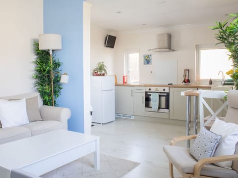 Furniture, Interior Design, Flooring, Room, Couch, Floor, Living Room, Table, Lighting, Ceiling