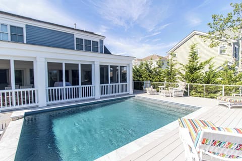 Relax in your private heated pool surrounded by lush landscaping.